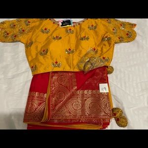 Yellow and red combination readymade blouse along with belt to wrap around.